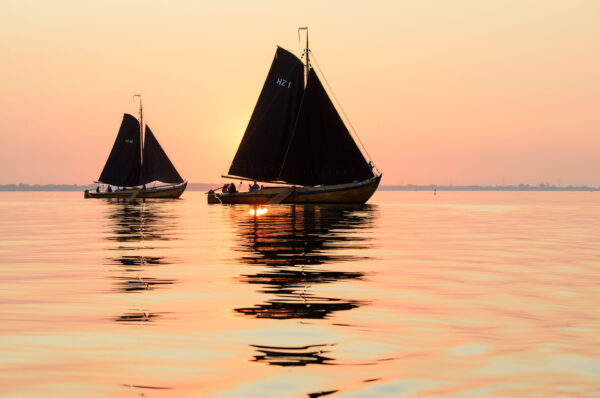 Huizer botters, ships at sunset